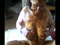 Busty slut rubbing her tits with poop